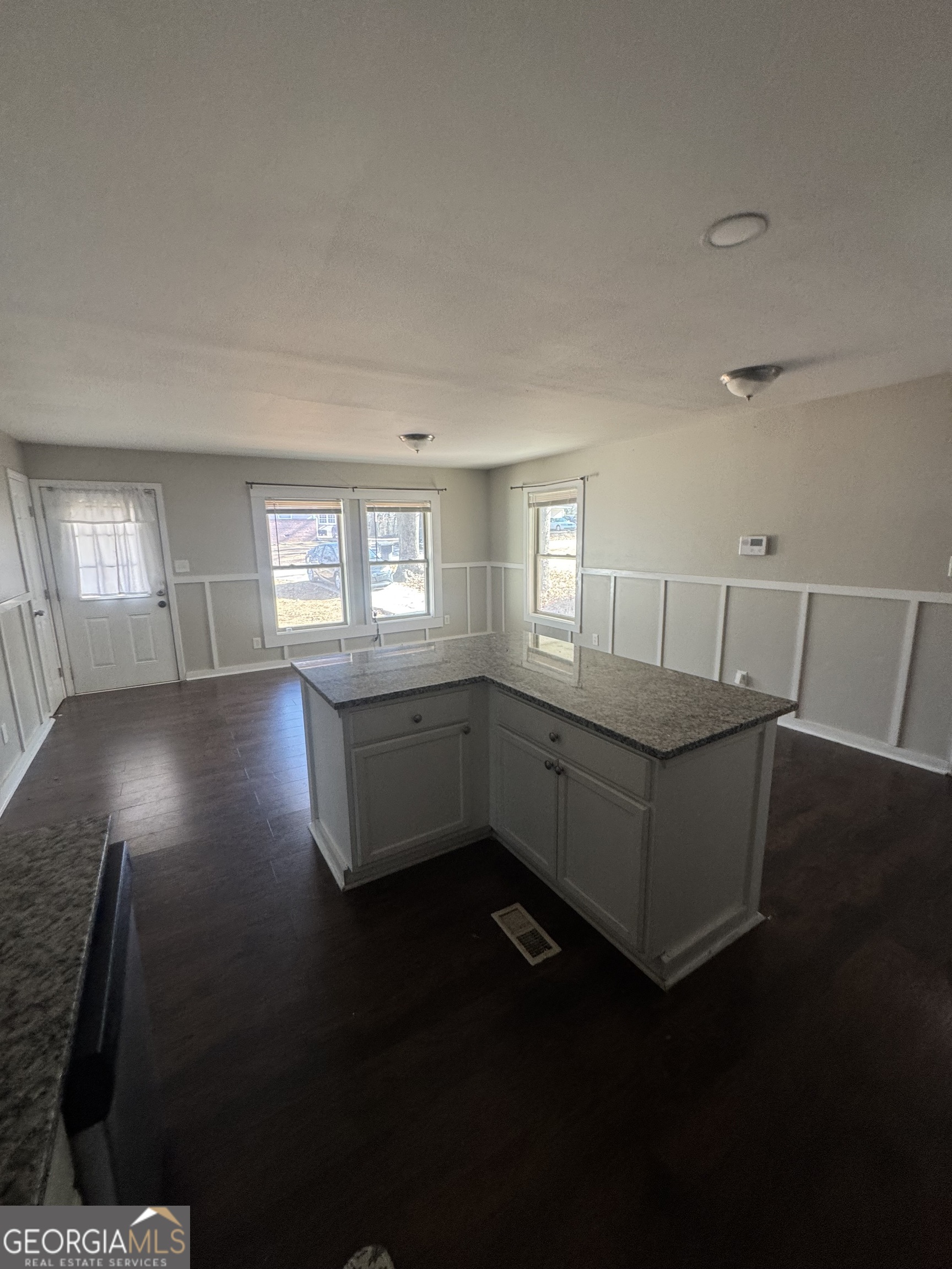 5205 Heather Lane Atlanta, GA 30349 - Photo 9 of 14 a living room with furniture and a wooden floor