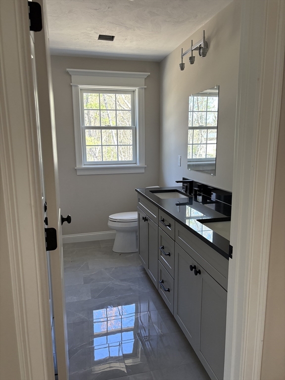 Lot 46 Rebecca Road Whitinsville, MA 01588 - Photo 12 of 13 a bathroom with a double vanity sink a toilet and a window