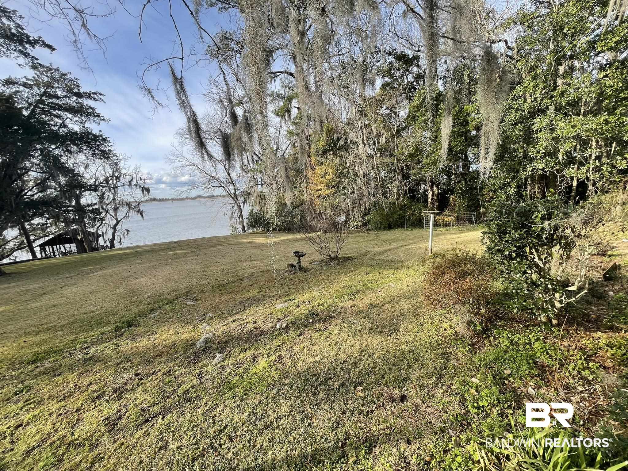 6621 Purvis Road Daphne, AL 36527 - Photo 51 of 59 View of grassy yard featuring a water view