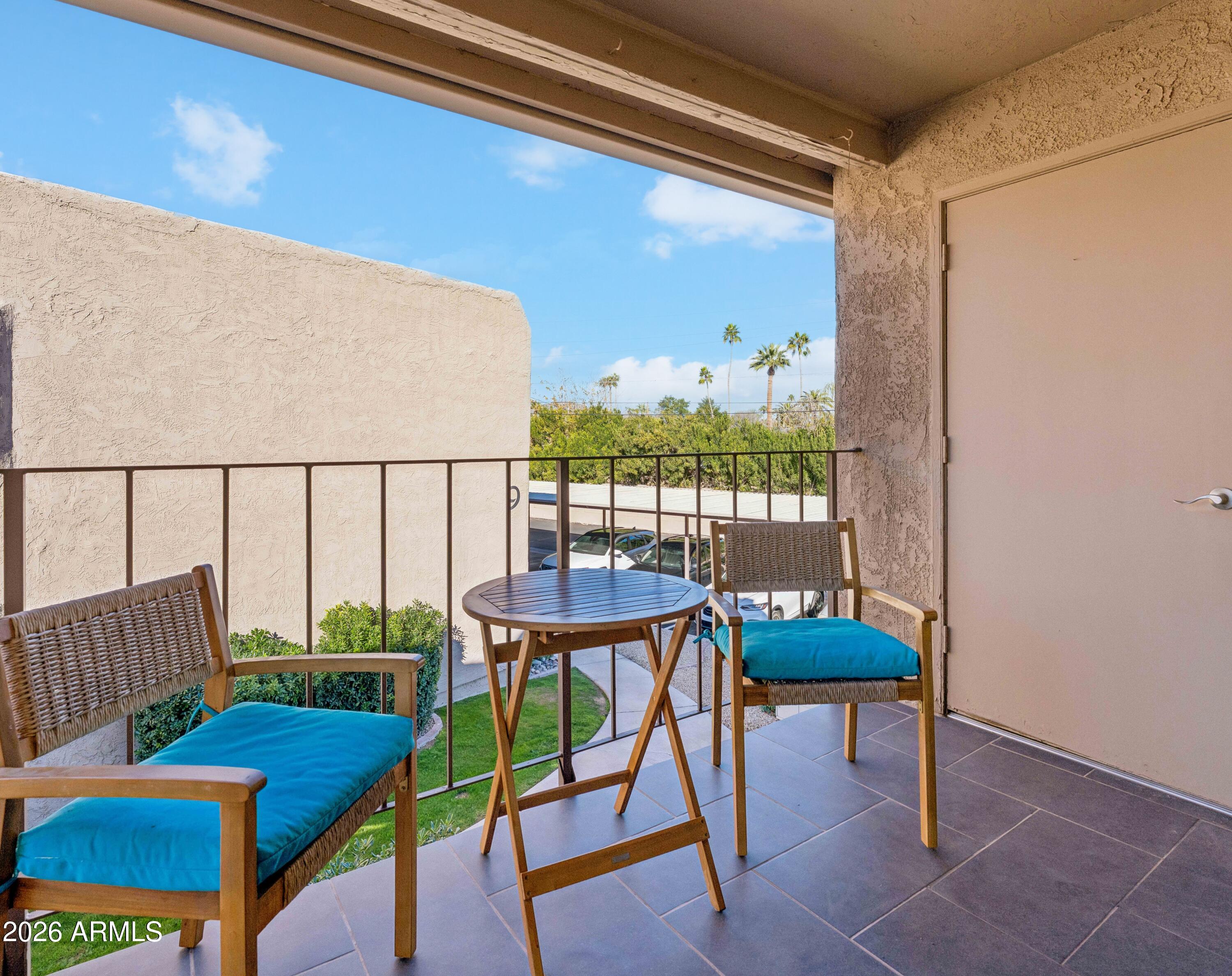 7436 East Chaparral Road, Unit B258 Scottsdale, AZ 85250 - Photo 14 of 23 a view of a chairs and table in the balcony