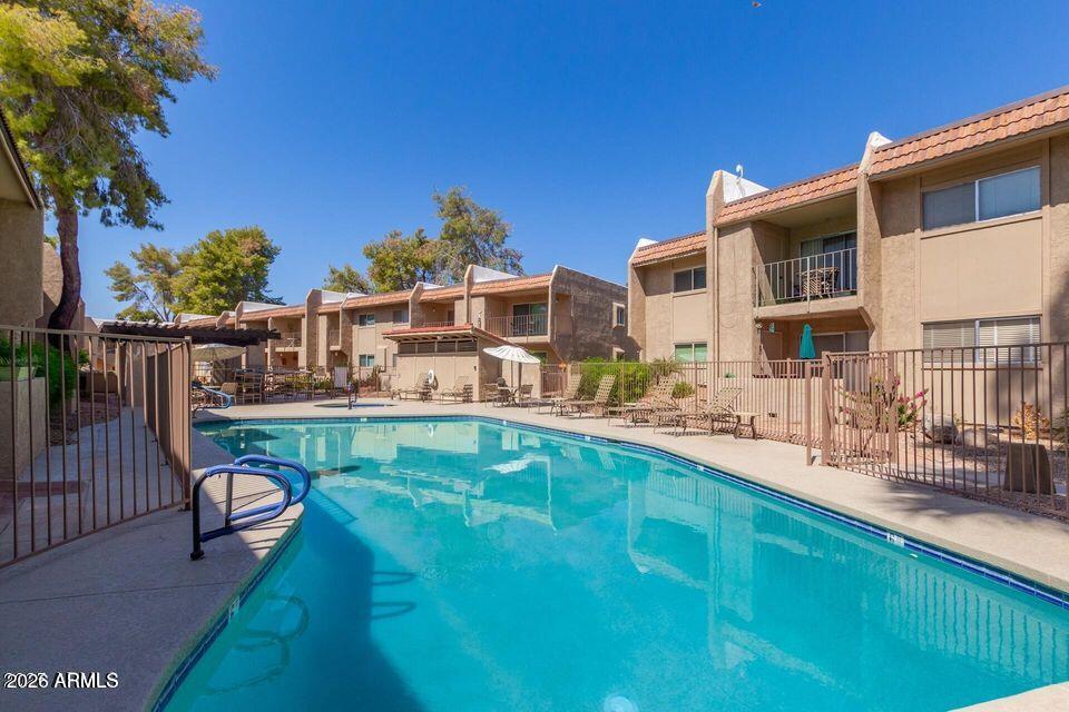 7436 East Chaparral Road, Unit B258 Scottsdale, AZ 85250 - Photo 15 of 23 a view of house with swimming pool outdoor seating