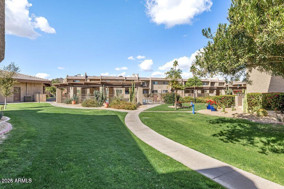 7436 East Chaparral Road, Unit B258 Scottsdale, AZ 85250 - Photo 20 of 23 a view of a house with a big yard