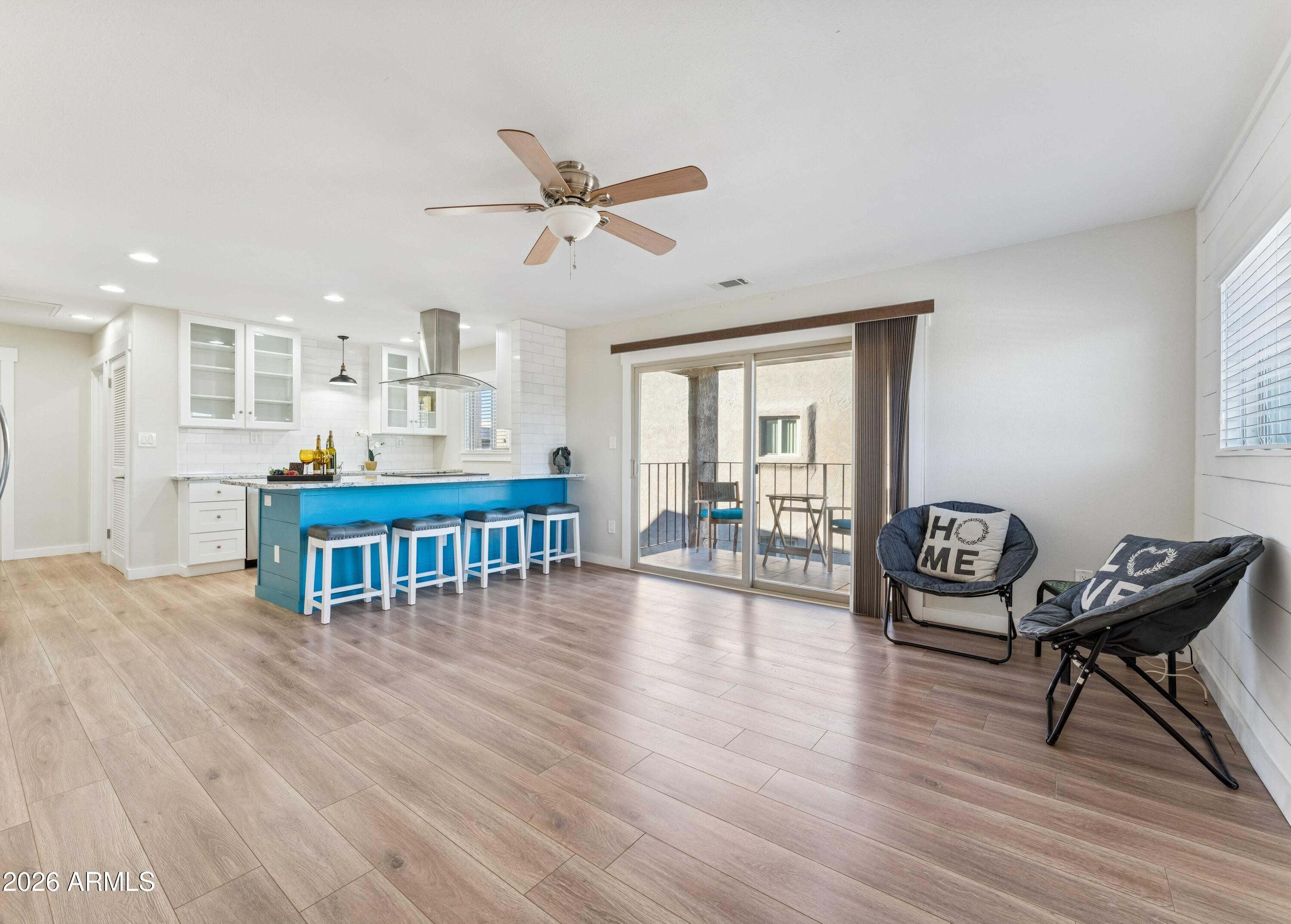 7436 East Chaparral Road, Unit B258 Scottsdale, AZ 85250 - Photo 2 of 23 a living room with furniture and wooden floor