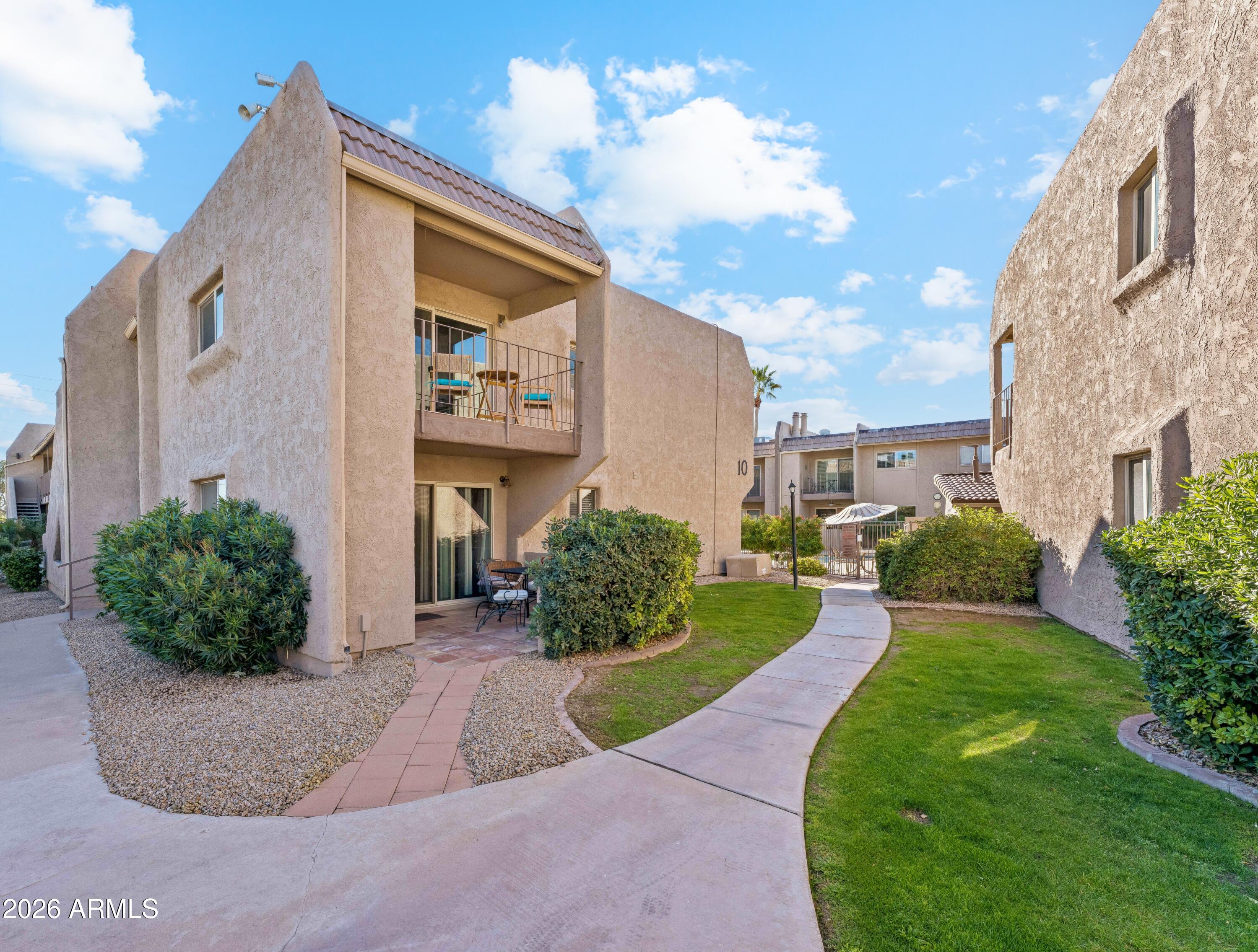 7436 East Chaparral Road, Unit B258 Scottsdale, AZ 85250 - Photo 6 of 23 a front view of a house with a yard