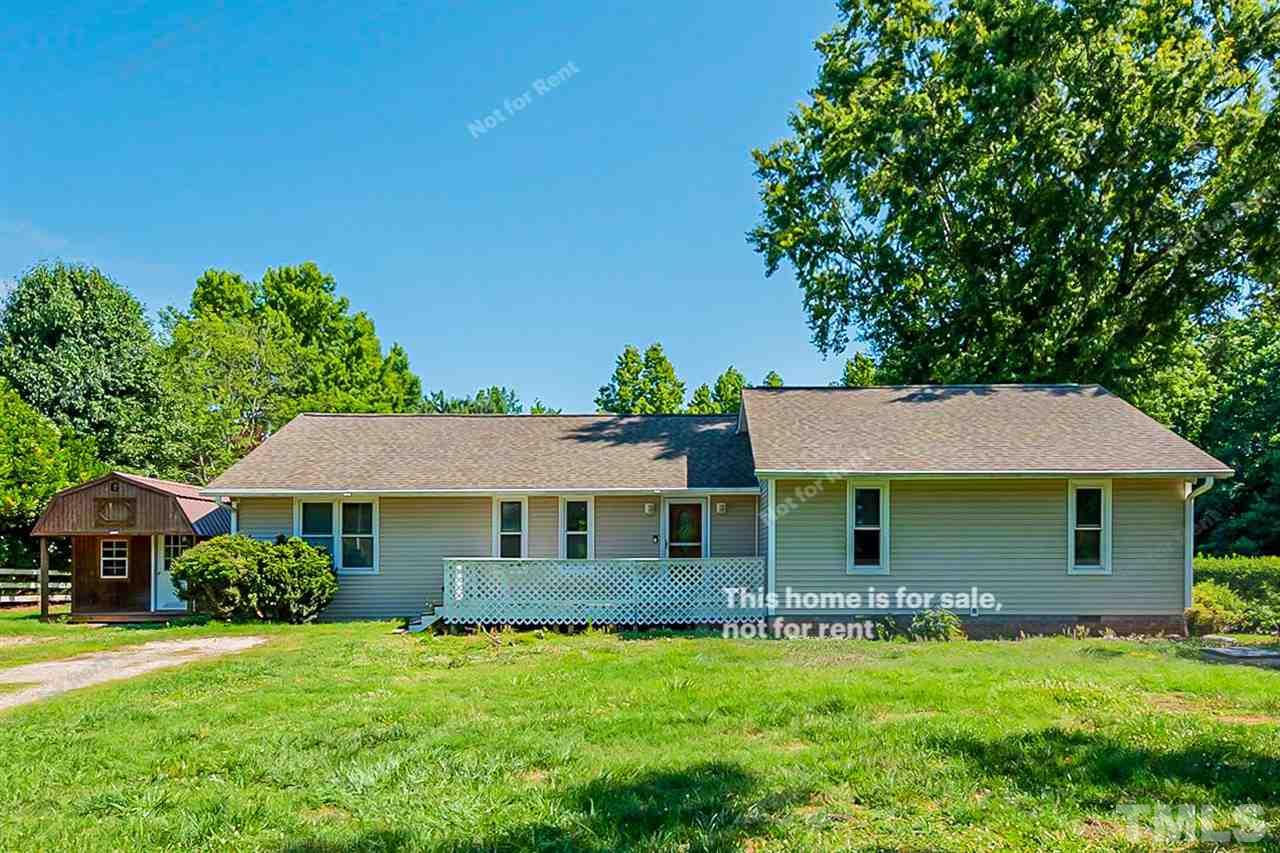 525 Rand Road Raleigh, NC 27603 - Photo 1 of 14 a front view of a house with a garden