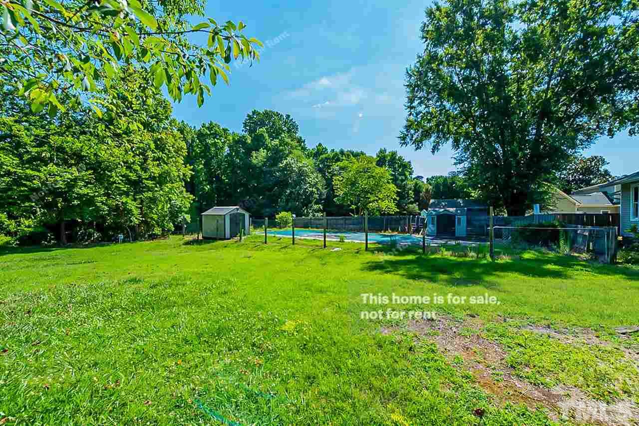 525 Rand Road Raleigh, NC 27603 - Photo 12 of 14 a view of a garden with a bench in a garden