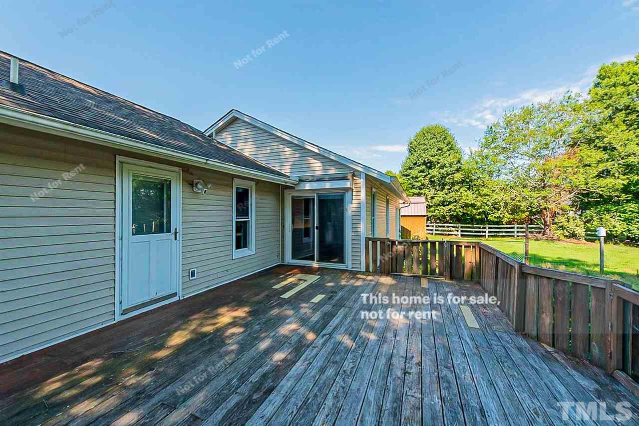 525 Rand Road Raleigh, NC 27603 - Photo 5 of 14 a view of a house with a small yard