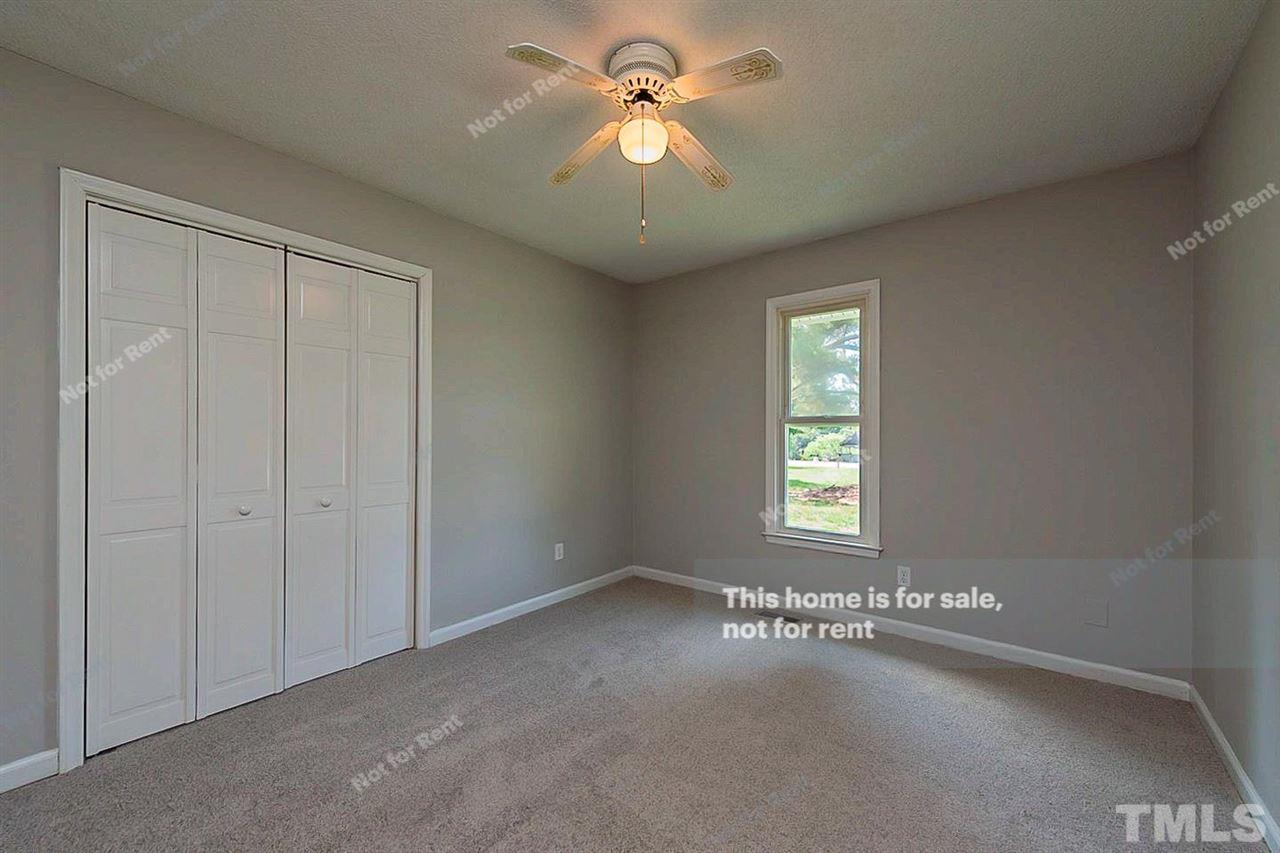 525 Rand Road Raleigh, NC 27603 - Photo 10 of 14 wooden floor in an empty room with a window