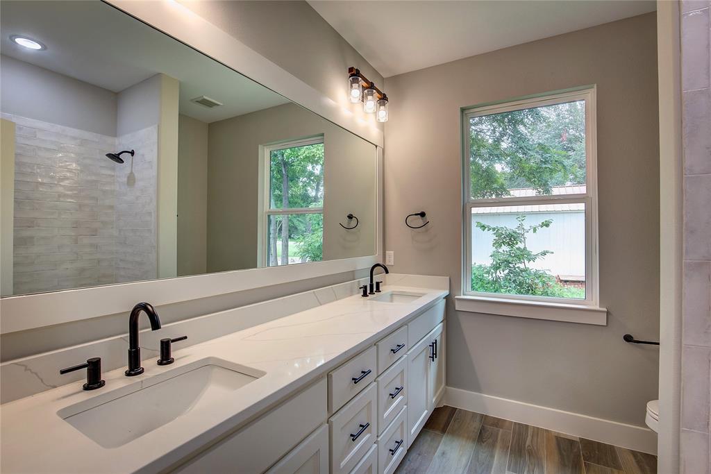 405 Door Key Ranch Road Trinidad, TX 75163 - Photo 15 of 28 Bathroom with dual vanity, toilet, and wood-type flooring