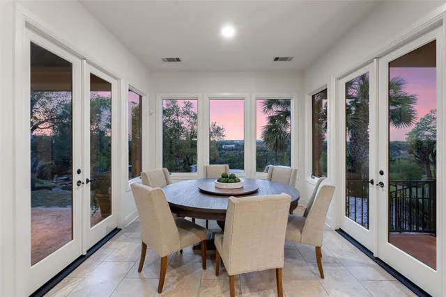 a dining room with furniture window and wooden floor