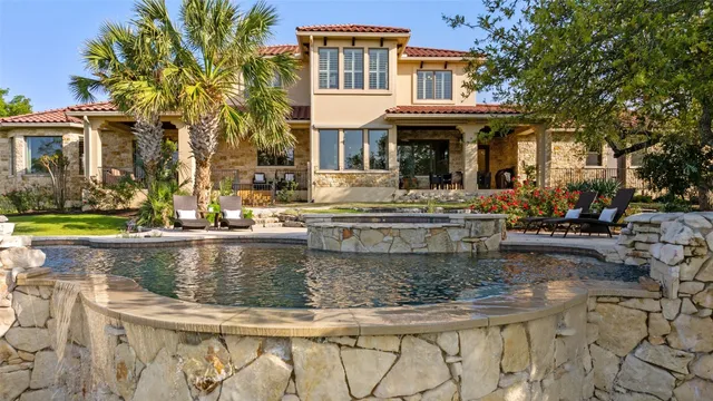 a view of a house with swimming pool
