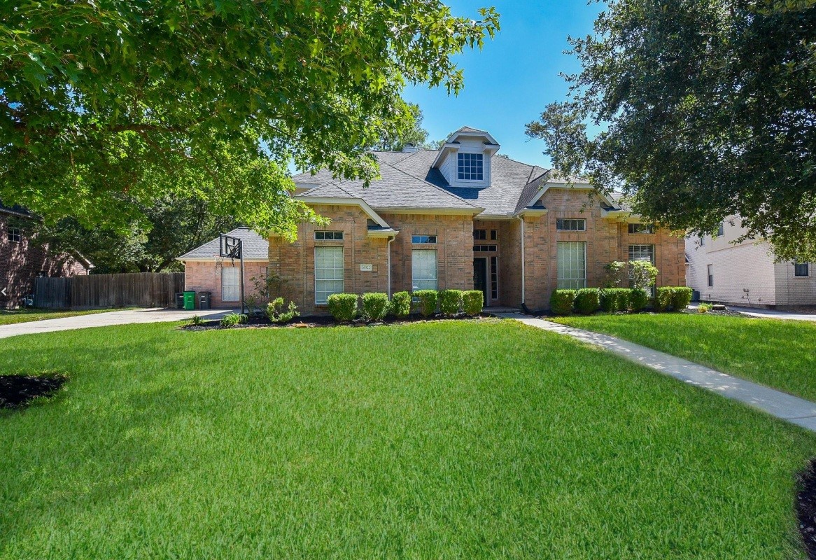16522 Champions Cove Circle Spring, TX 77379 - Photo 1 of 30 a front view of house with yard and green space