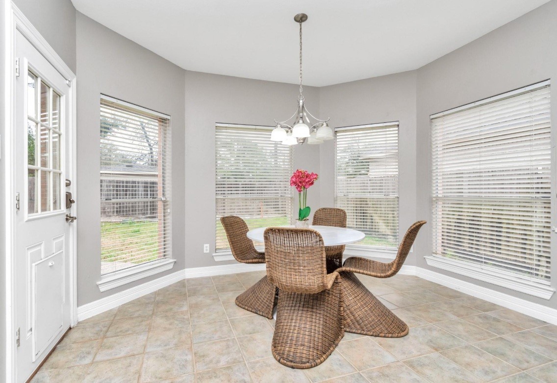 16522 Champions Cove Circle Spring, TX 77379 - Photo 13 of 30 a dining room with furniture and windows