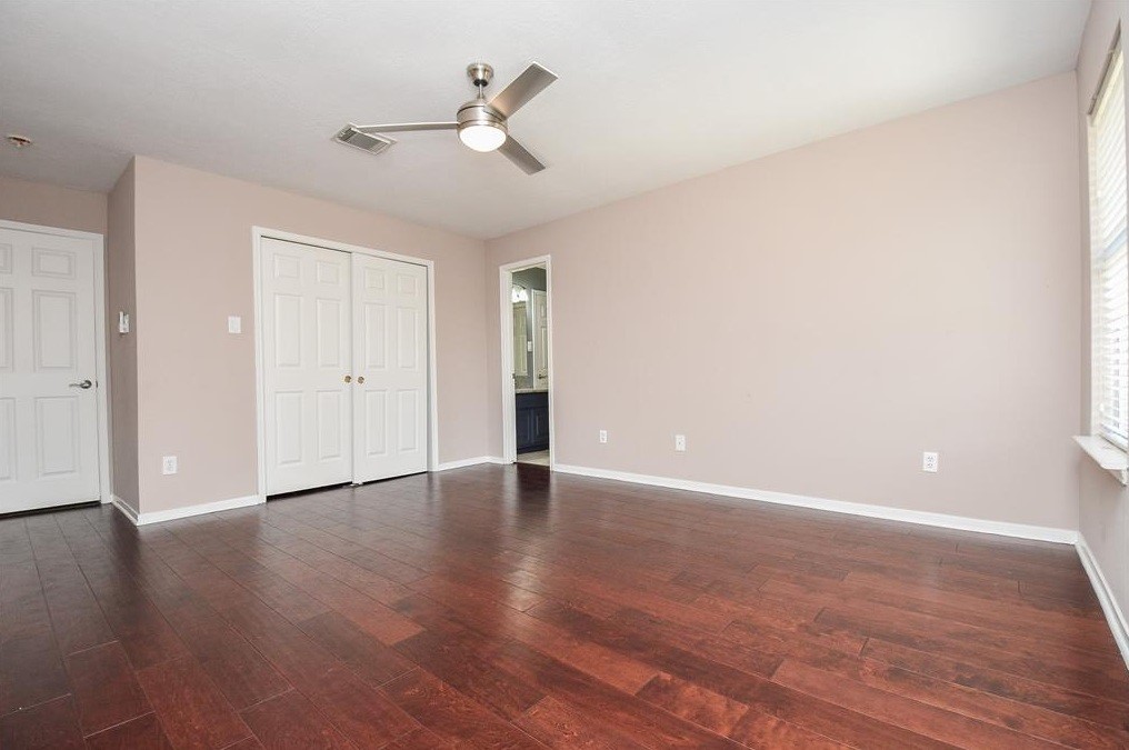 16522 Champions Cove Circle Spring, TX 77379 - Photo 27 of 30 a view of an empty room with wooden floor