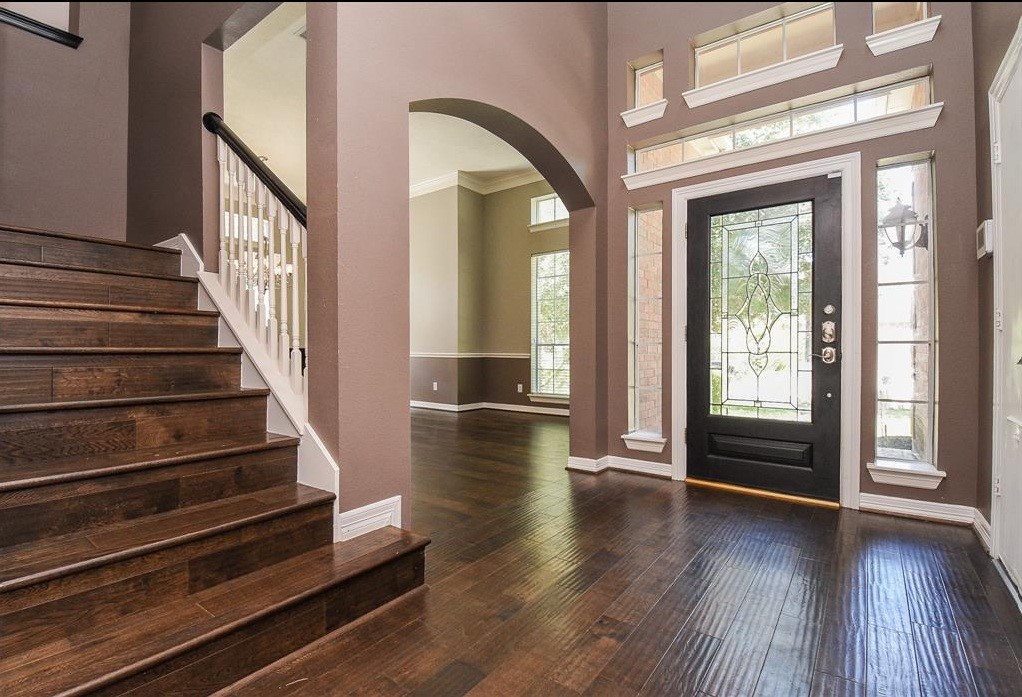 16522 Champions Cove Circle Spring, TX 77379 - Photo 3 of 30 a view of an entryway with wooden floor and windows