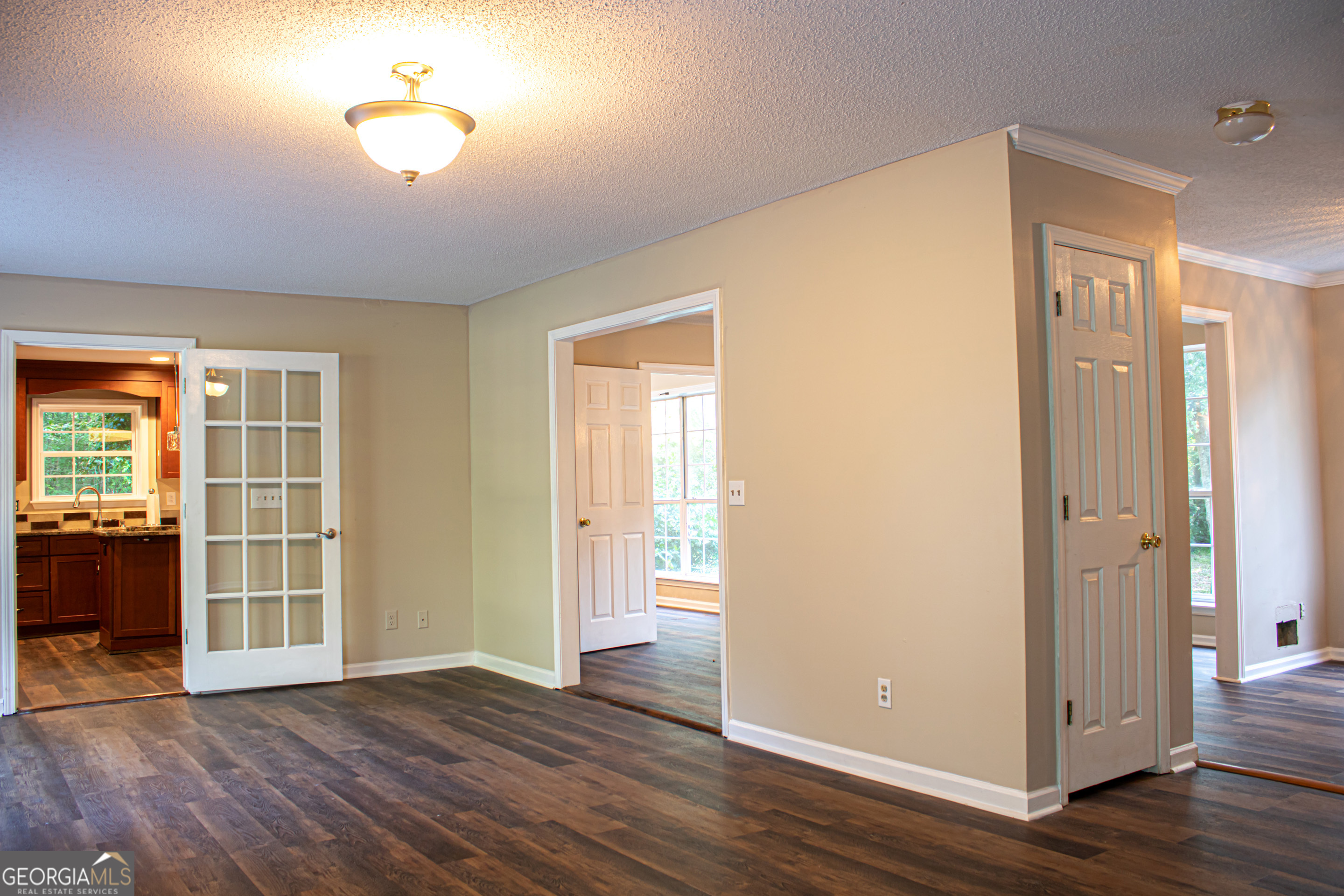 240 Harkness Road Jackson, GA 30233 - Photo 11 of 54 an empty room with wooden floor and windows