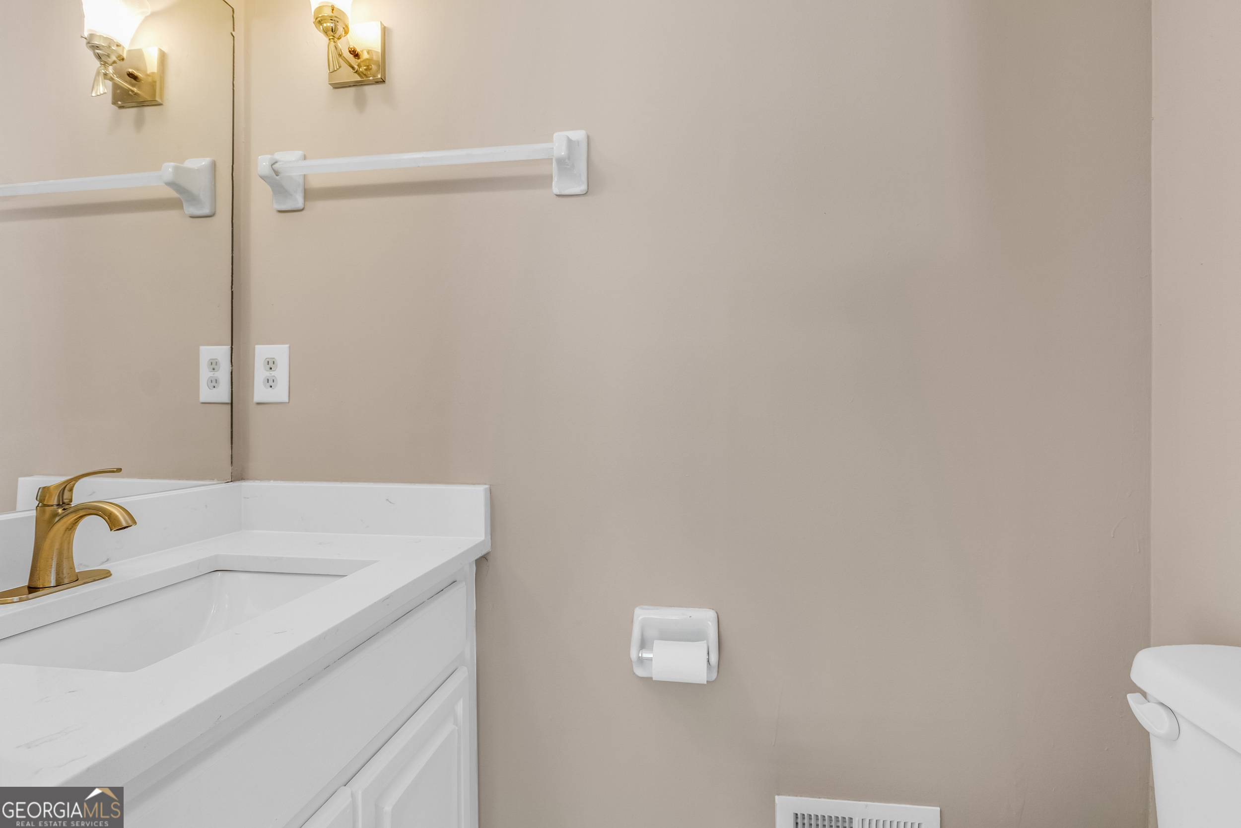 240 Harkness Road Jackson, GA 30233 - Photo 29 of 54 a bathroom with a sink and vanity
