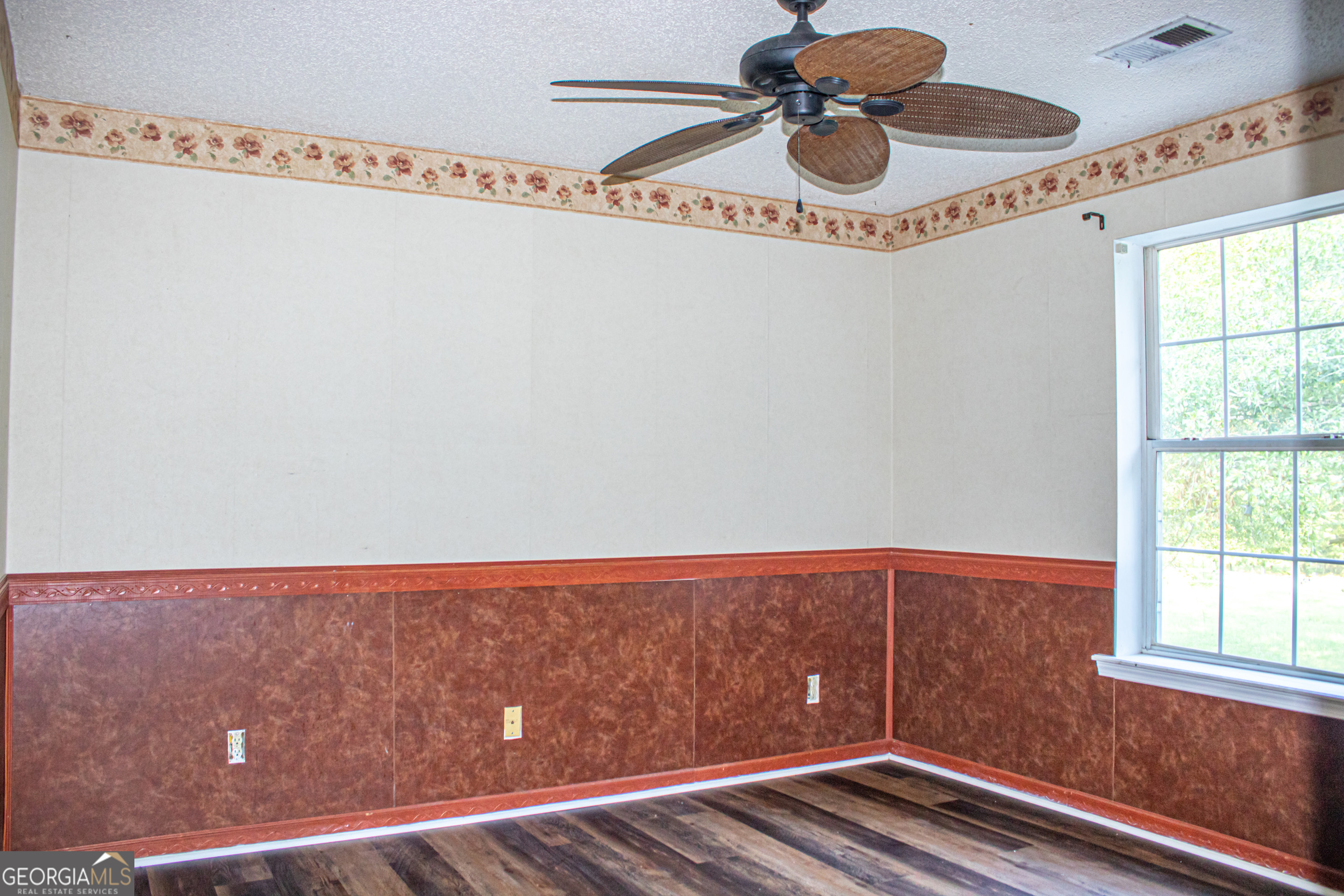 240 Harkness Road Jackson, GA 30233 - Photo 39 of 54 a view of room with window and wooden floor