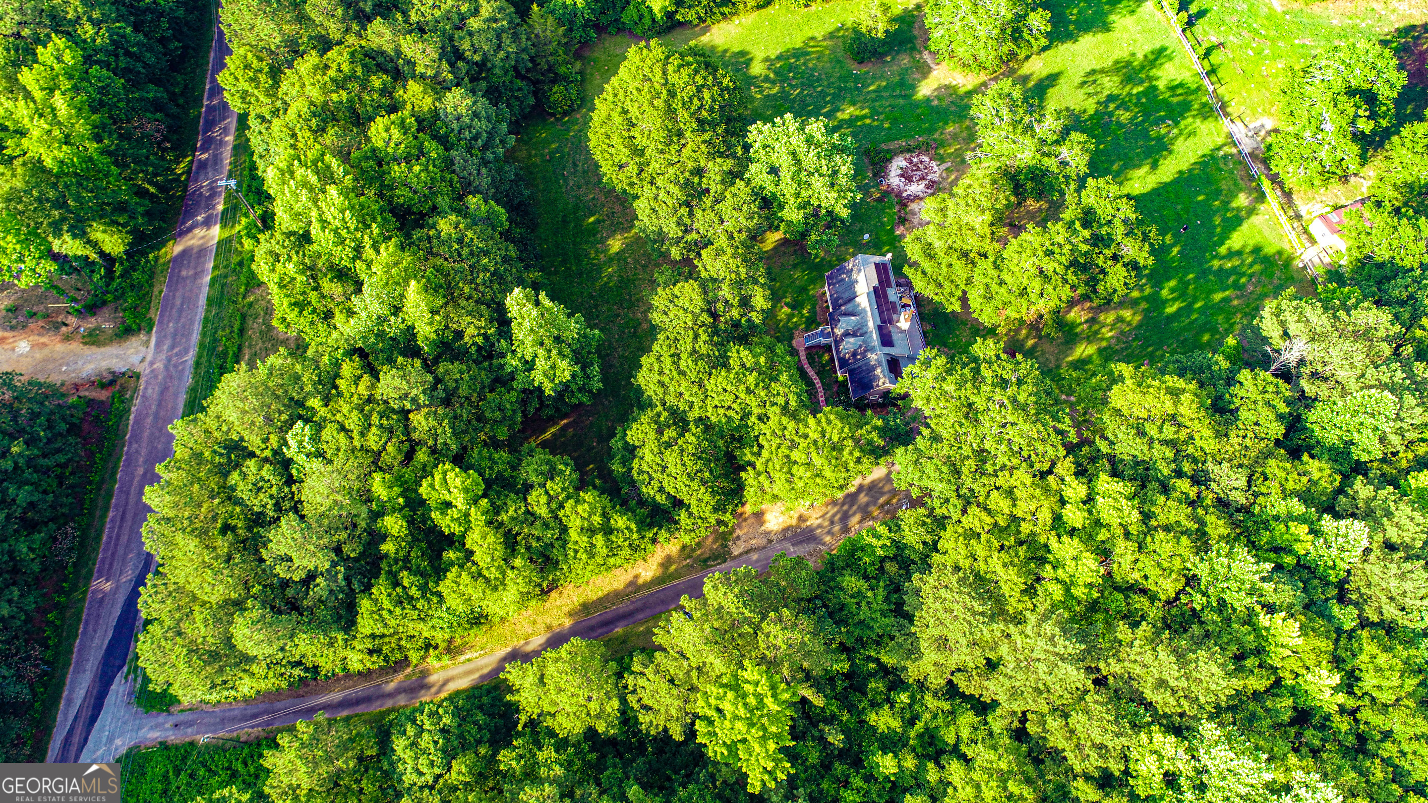 240 Harkness Road Jackson, GA 30233 - Photo 52 of 54 a backyard of a house with lots of green space