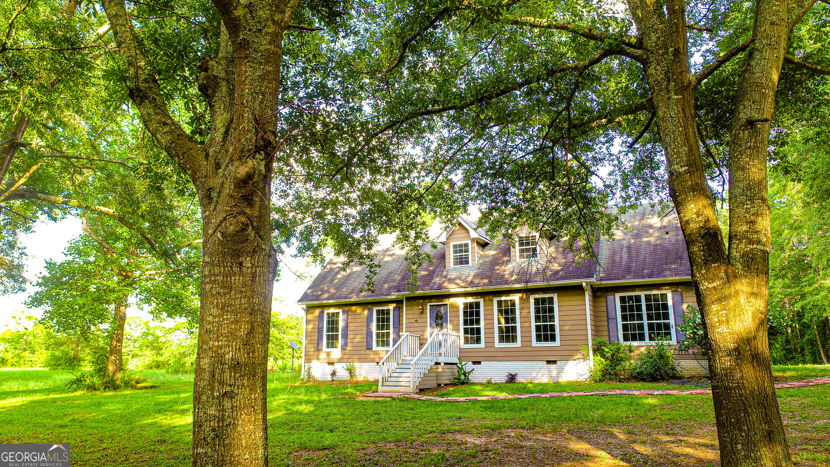 240 Harkness Road Jackson, GA 30233 - Photo 6 of 54 front view of a house with a yard