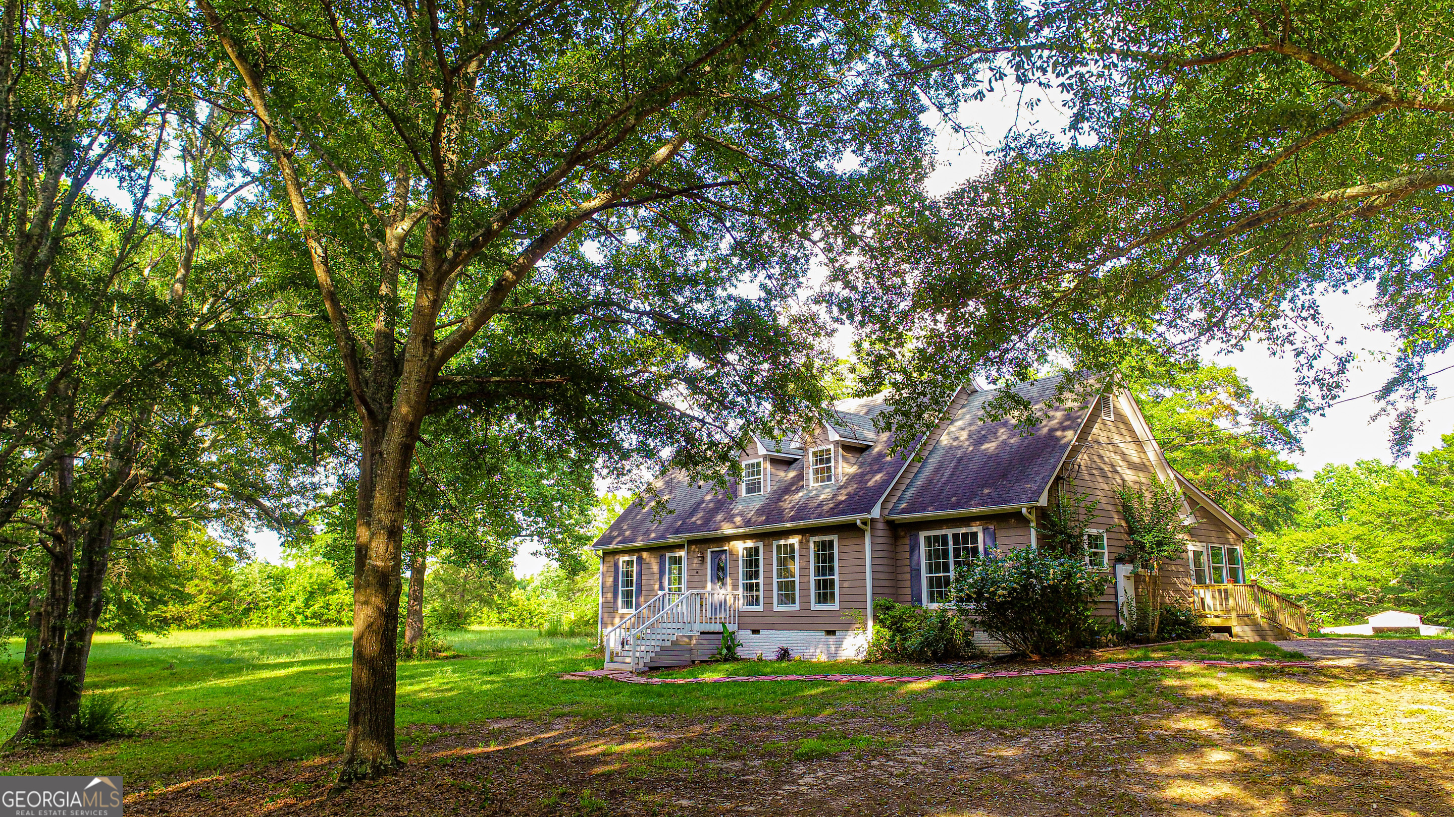 240 Harkness Road Jackson, GA 30233 - Photo 8 of 54 front view of house with a yard