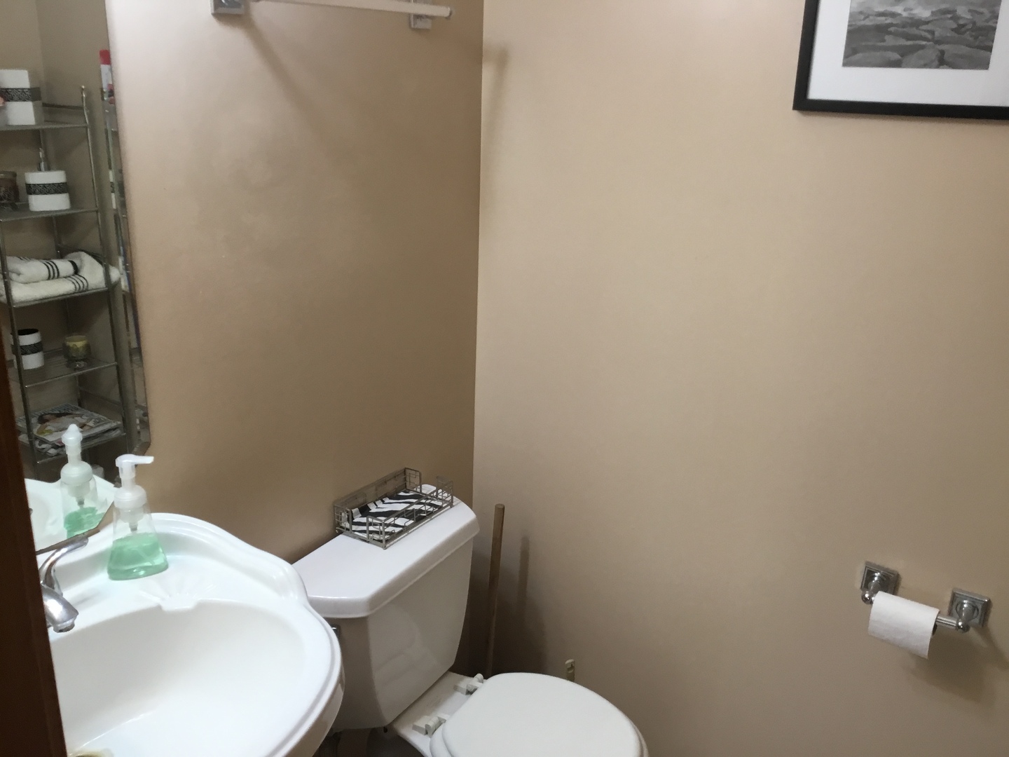 4741 West Lilac Avenue Monee, IL 60449 - Photo 19 of 28 a white toilet sitting next to a bathroom sink