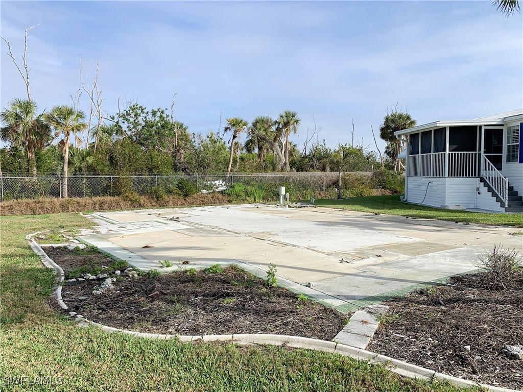 19681 Summerlin Road, Unit 609T Fort Myers, FL 33908 - Photo 11 of 20 a view of a backyard