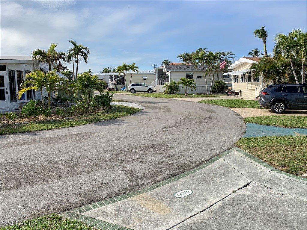 19681 Summerlin Road, Unit 609T Fort Myers, FL 33908 - Photo 13 of 20 an aerial view of a house with outdoor space