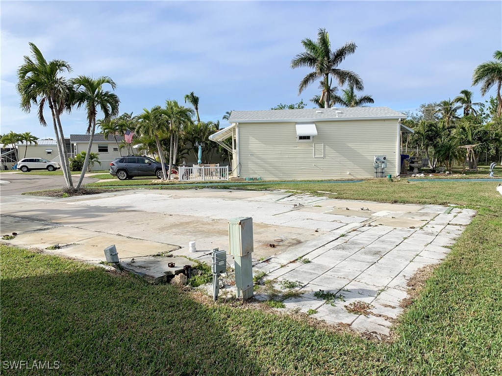 19681 Summerlin Road, Unit 609T Fort Myers, FL 33908 - Photo 6 of 20 a front view of a house with garden