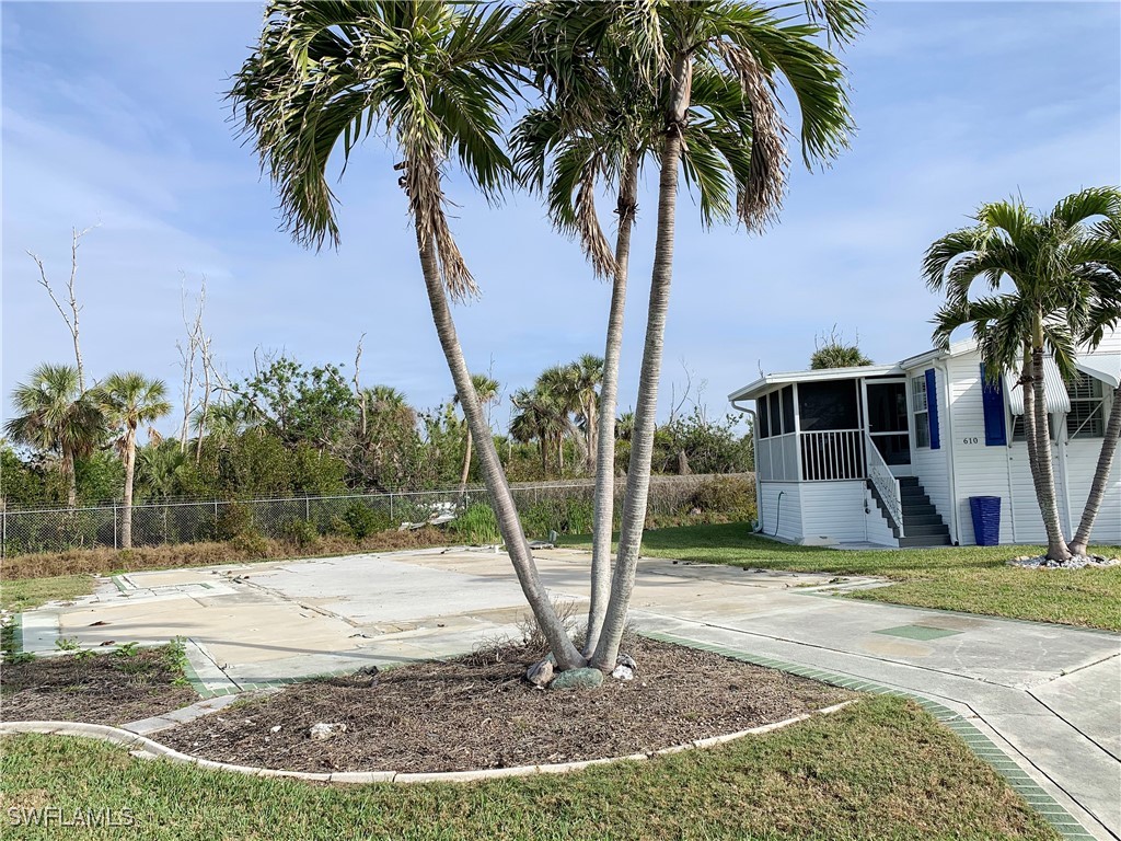 19681 Summerlin Road, Unit 609T Fort Myers, FL 33908 - Photo 8 of 20 a view of a backyard