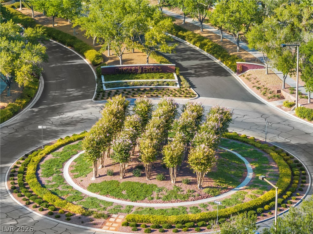 2000 Grouse Street Las Vegas, NV 89134 - Photo 74 of 89 Eagle Hills community entrance boasts mature landscaping with lush trees and a beautifully manicured central island.
