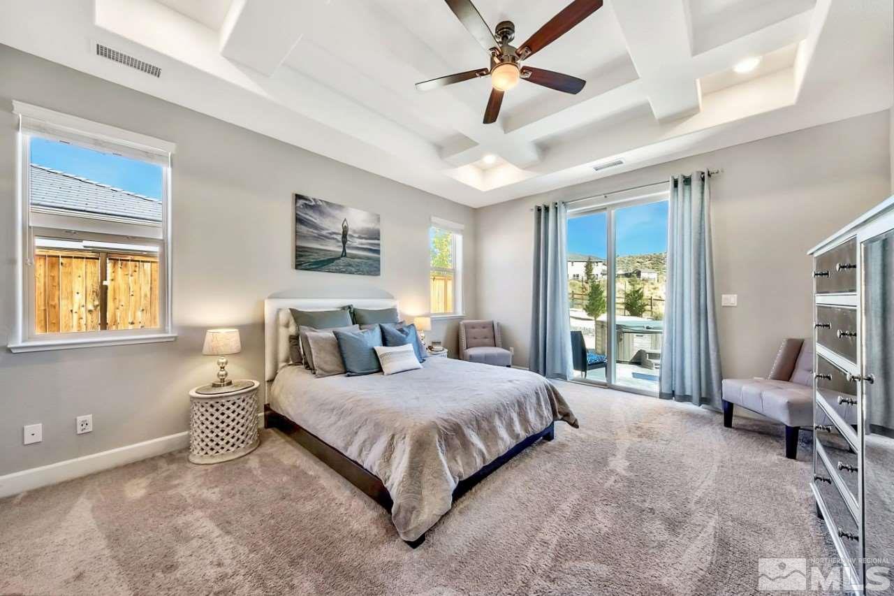 2010 Back Nine Trail Reno, NV 89523 - Photo 13 of 25 a bedroom with a large bed and a chandelier fan