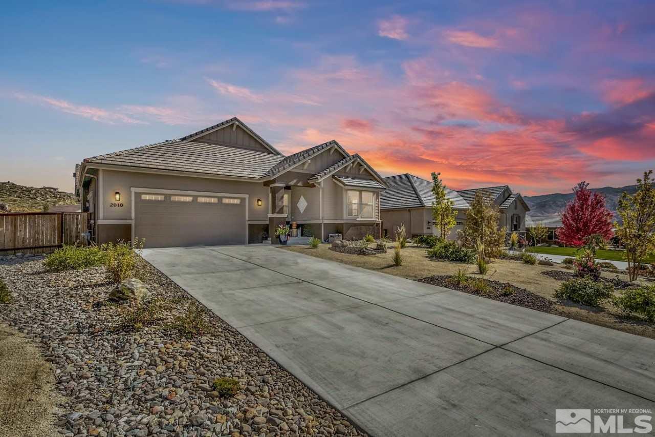2010 Back Nine Trail Reno, NV 89523 - Photo 2 of 25 a front view of a house with a yard and garage
