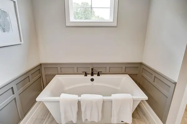 a view of a livingroom with furniture and an empty room