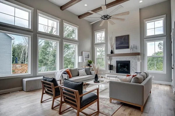 a kitchen with stainless steel appliances granite countertop a sink a stove a refrigerator and island