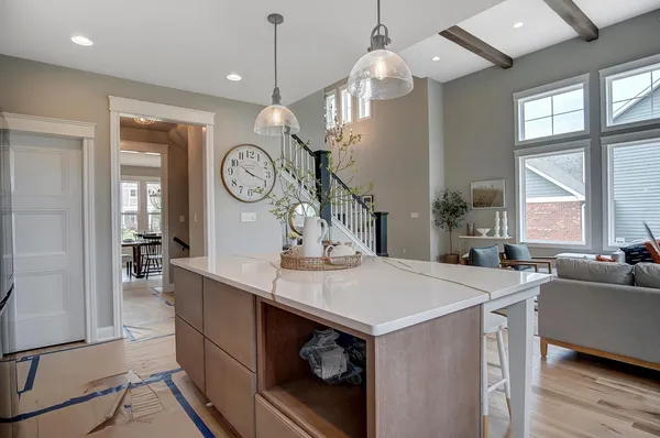 a view of a dining room with furniture wooden floor and chandelier