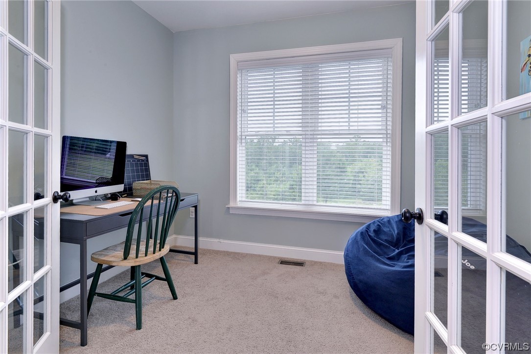 2970 Evergreen Road Providence Forge, VA 23140 - Photo 16 of 48 a living room with furniture a flat screen tv and a window