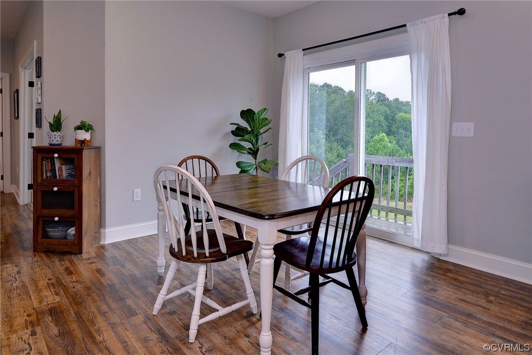 2970 Evergreen Road Providence Forge, VA 23140 - Photo 18 of 48 a view of a dining room with furniture window and wooden floor