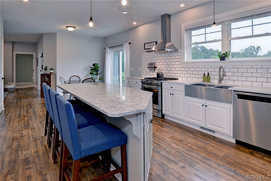 2970 Evergreen Road Providence Forge, VA 23140 - Photo 23 of 48 a kitchen with granite countertop a table chairs a sink dishwasher refrigerator and microwave
