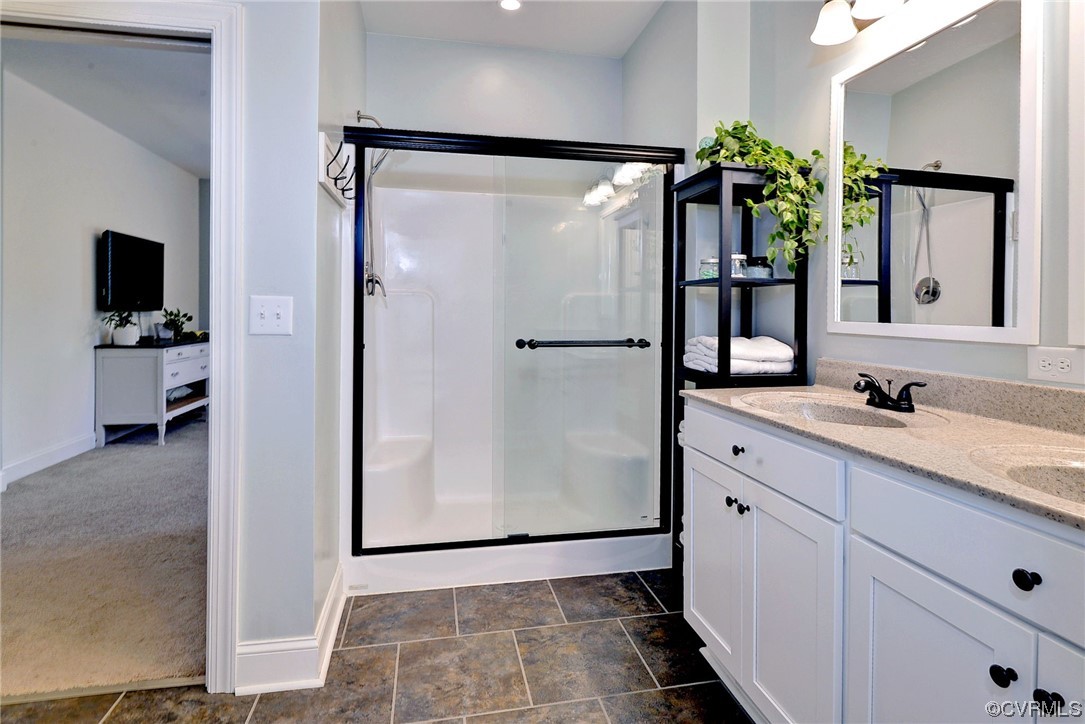 2970 Evergreen Road Providence Forge, VA 23140 - Photo 27 of 48 a bathroom with a double vanity sink and mirror