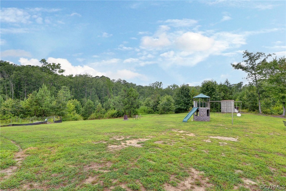 2970 Evergreen Road Providence Forge, VA 23140 - Photo 44 of 48 a backyard of a house with table and chairs