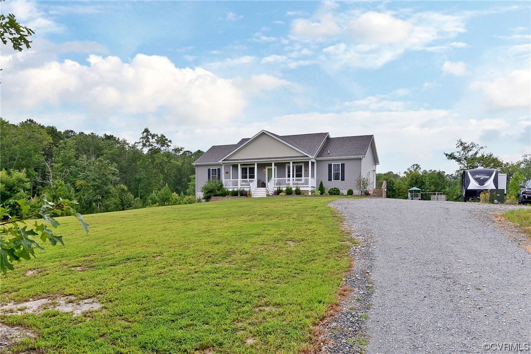 2970 Evergreen Road Providence Forge, VA 23140 - Photo 5 of 48 a front view of a house with garden