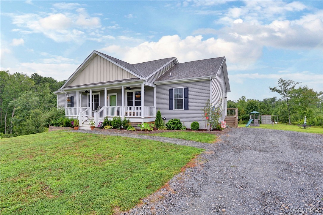 2970 Evergreen Road Providence Forge, VA 23140 - Photo 7 of 48 a front view of a house with a yard and garage