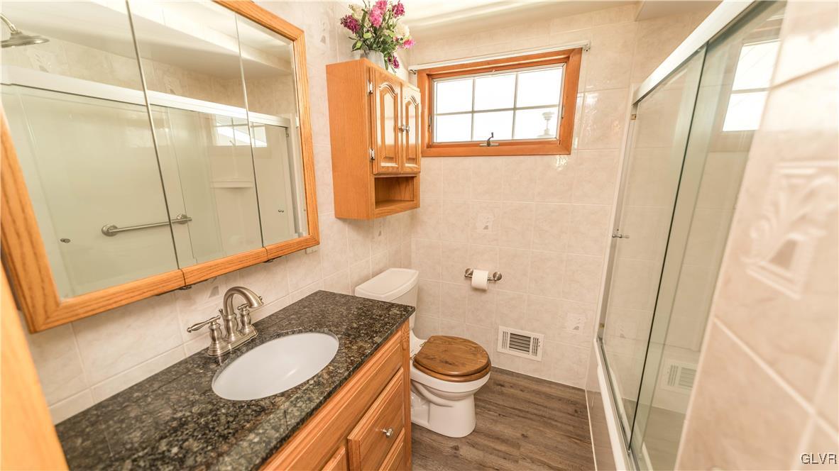 2115 Cypress Road Bethlehem, PA 18018 - Photo 19 of 30 Granite vanity, luxury vinyl flooring, medicine ca