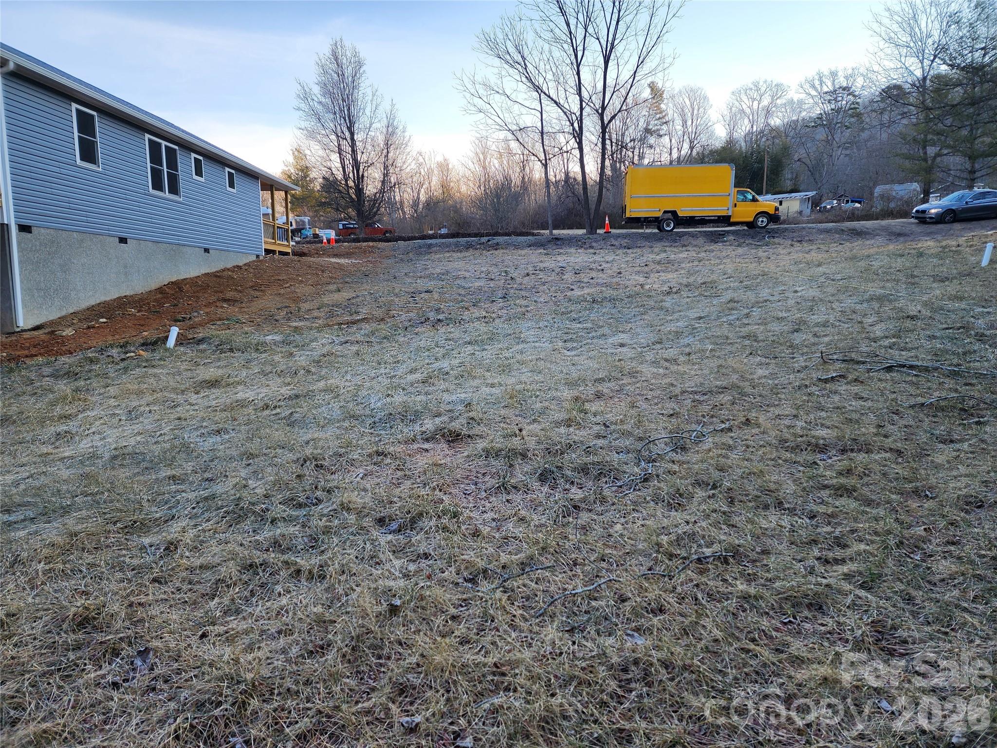 237 Edgewood Road South, Unit 2 Asheville, NC 28803 - Photo 3 of 4 a front view of a house with a yard