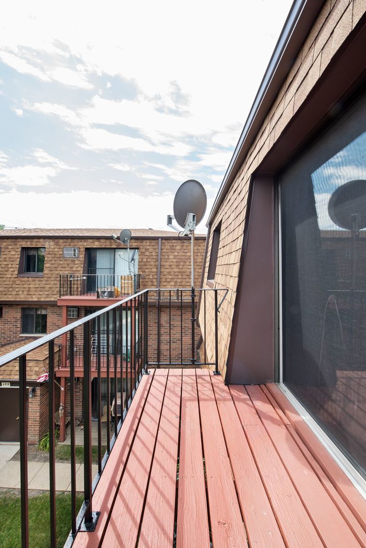 493 McHenry Road, Unit 3B Wheeling, IL 60090 - Photo 17 of 18 a view of balcony with wooden floor