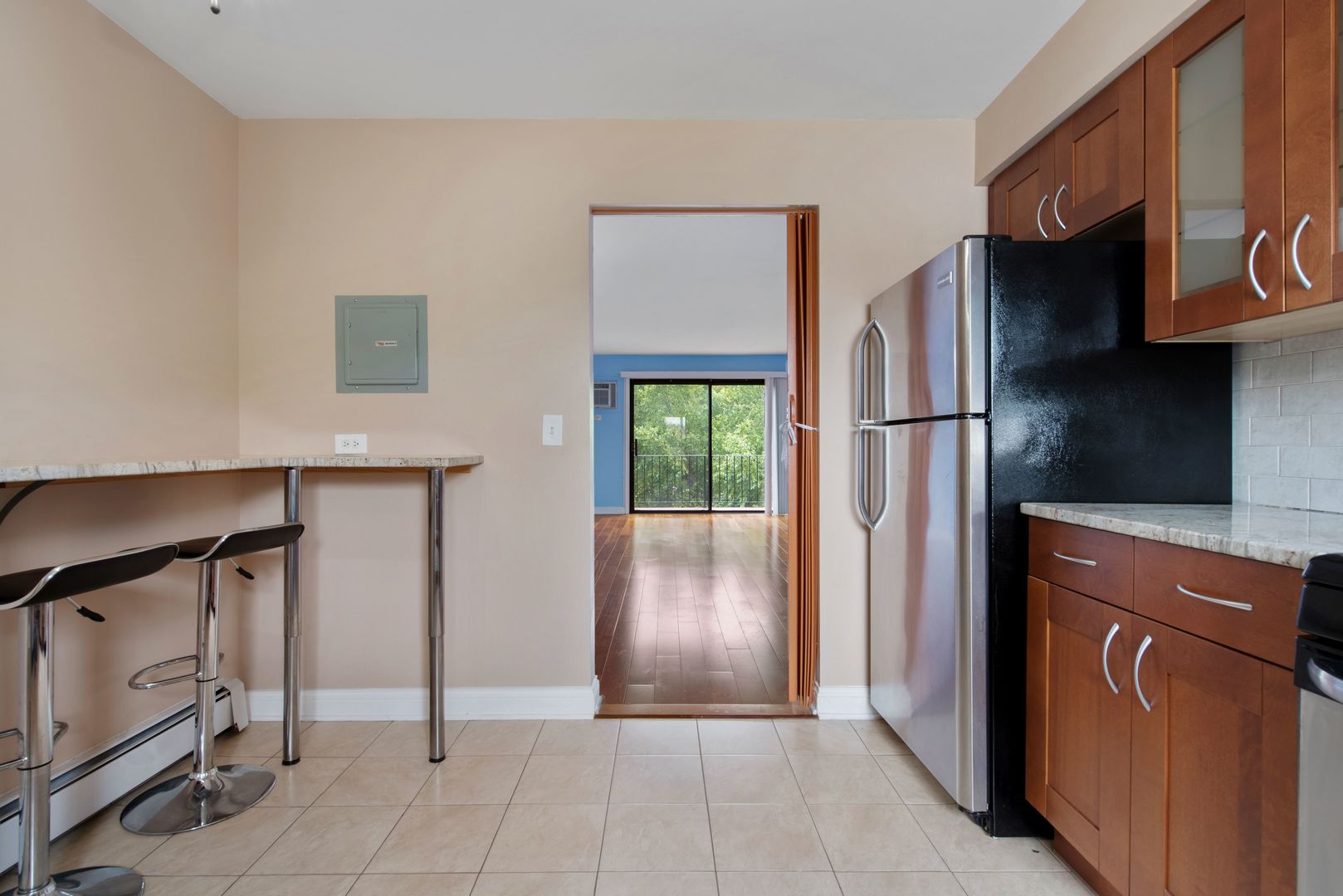 493 McHenry Road, Unit 3B Wheeling, IL 60090 - Photo 5 of 18 a view of a kitchen with refrigerator and cabinet