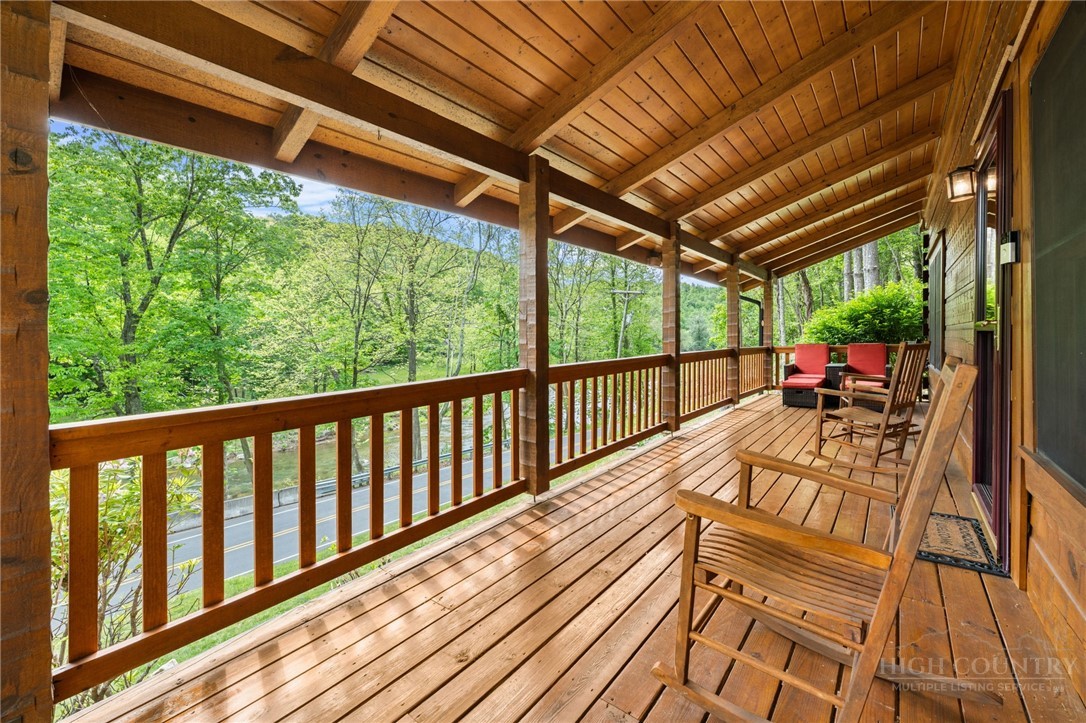 613 Silas Creek Road Lansing, NC 28643 - Photo 10 of 40 a view of balcony with wooden floor