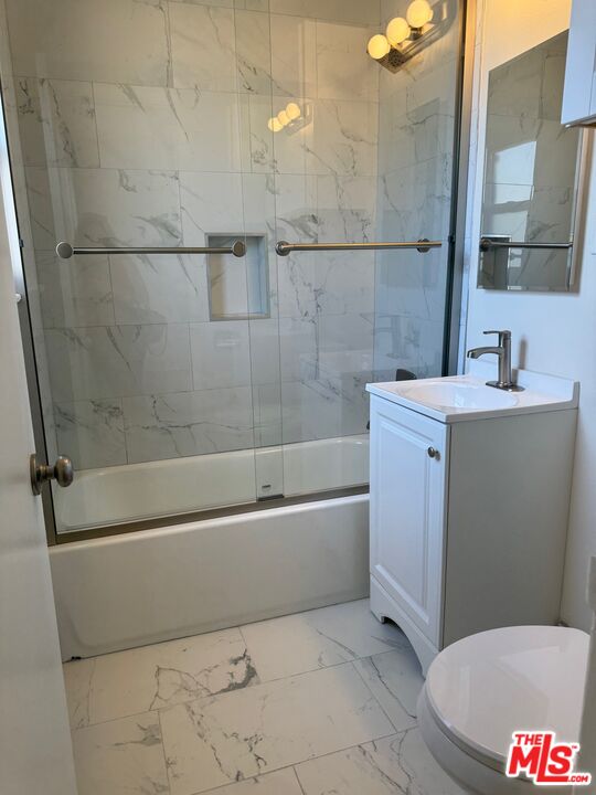 1336 Berkeley Street, Unit 2 Santa Monica, CA 90404 - Photo 4 of 8 a bathroom with a sink a toilet and shower