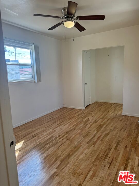 1336 Berkeley Street, Unit 2 Santa Monica, CA 90404 - Photo 5 of 8 a view of empty room with wooden floor and fan